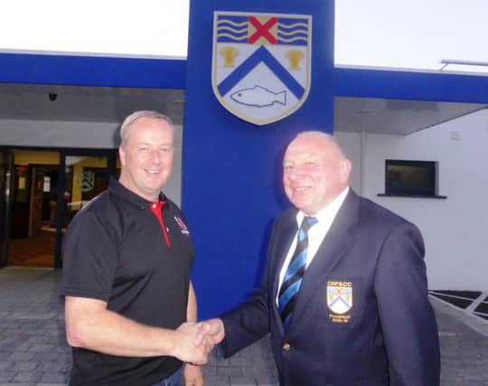Gerry Lafferty, Community Rugby Officer, is welcomed by Coleraine RFCC club president Kevin Bradley.