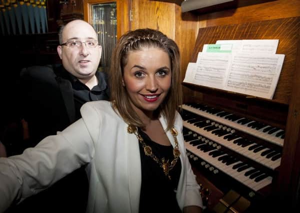 The Mayor, Councillor Elisha McCallion pictured with organist Stewart Smyth in the organ tower at the Guildhall on Sunday.