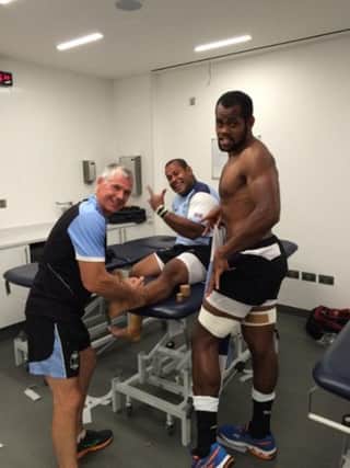 Brian Downey tends to some Fijian players.