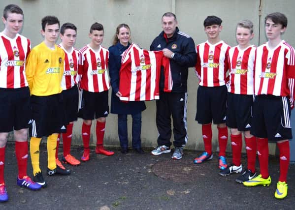 Carniny Youth Under 15 Coach Alex Rainey receives new playing kit from Subway Franchisee Jennie Herald as part of the NIBFA Subway National League Sponsorship deal.