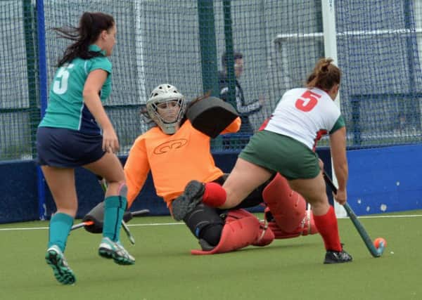 Carrick Ladies goalkeeper Rebecca Whiteside thwarts this Greenisland Ladies attack. INCT 39-030-PSB