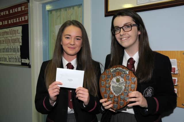 Year 11 pupils Robyn Clarke and Connie Smyth with their achievement awards. INCT 39-210-AM