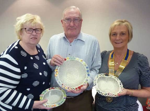 Helen and Trevor Rankin with Carrickfergus Rotary Club President Brenda Houston and some of the baskets from their Belleek collection.  INCT 39-704-CON