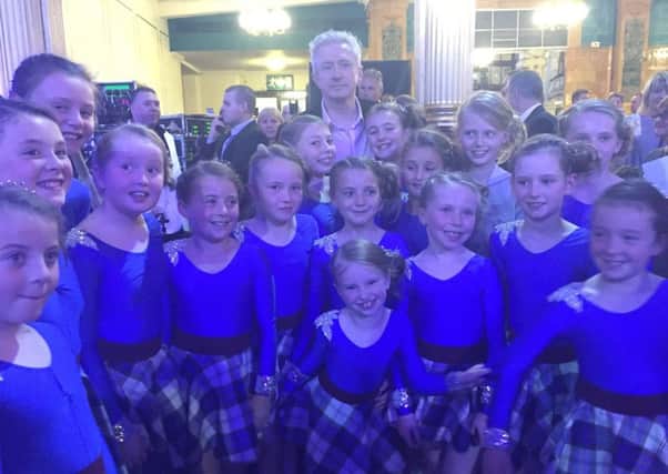 Dancers with the Sollus Highland Dance Team pictured in Blackpool with X Factor Judge and TV personality Louis Walsh.