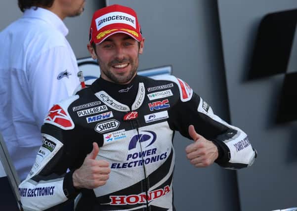 Eugene Laverty gives the thumbs-up after securing his first MotoGP open race victory in Spain. Picture: Bonnie Lane.