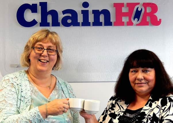 Chain HR celebrated a move into larger premises in LEDCOM'S Innovation Suite in Larne by raising funds for cancer charity MacMillan Cancer Support. Pictured are Audrey Murray, general manager, and Anne Taylor, recruitment and development executive officer.