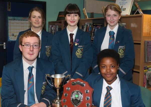 Prize winners at Slemish College awards ceremony. Back row L-R, Marie Allen who won the Stewart Cup for GCSE English, Abigail Fletcher who won the Millican Trophy for Debating, Sarah Emery who won the Stewart Cup for Languages. Front, L-R, Andrew Welsh who won the Boyle Cup for GCSE History and Phumi Sobopha who won the Elizabeth Law Shield for KS3 Music. INBT 40-104JC