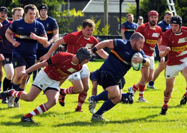 Captain Tom Fraser leads the charge for Lisburn. Pic by Gary Barlow.