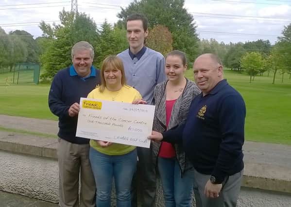 Sarah from Friends from the Cancer Centre receives a cheque from Lambeg Golf Club Captain, Stephen Boyd and Club President, Ritchie Gorman. Also included are Michael and Robyn Baxter.