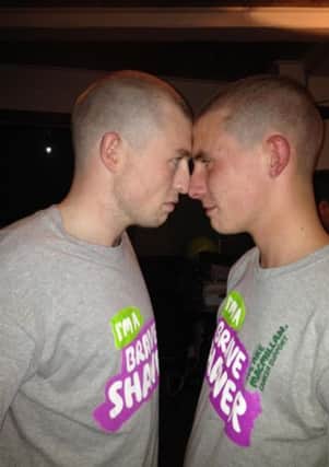 Chris and Michael McGrath, who took part in a 'Brave the Shave' event to raise money for Macmillan Cancer Support.