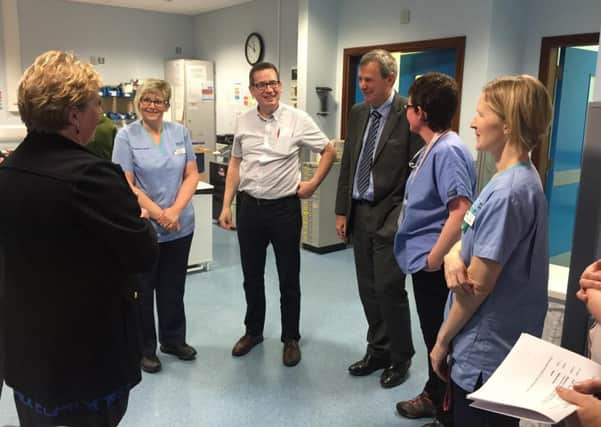 Mr Richard Pengelly meeting with Emergency Department staff in Craigavon Area Hospital .