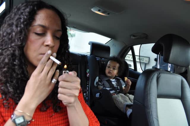 Any driver or passenger caught smoking in a car with children could be fined £50