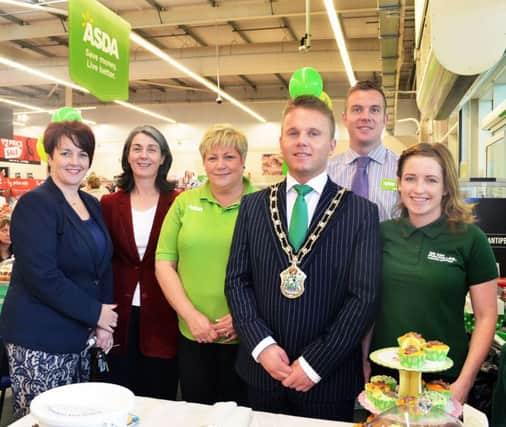 Antrim's ASDA staff Barbara and Stuart Legge (Deputy Store Manager)  join Councillor Roisin Lynch and Pam Cameron, MLA, with Antrim's Mayor Thomas Hogg supporting the MacMillan coffee morning. Included is Natasha Strain of MacMillan. INBT 40-835H