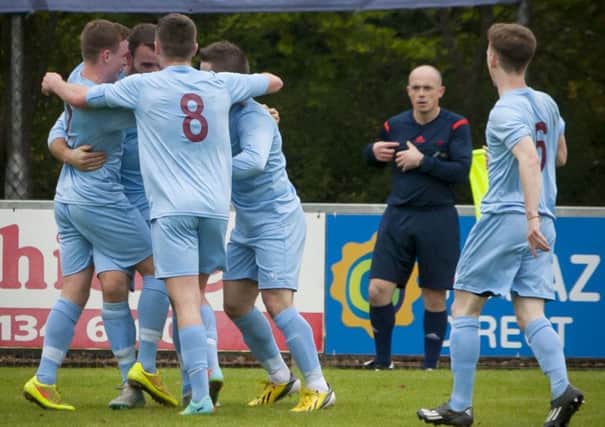 Institute players celebrate with goalscorer Garbhan Friel after he opened the scoring against Lurgan Celtic on Saturday. INLS3915MC029