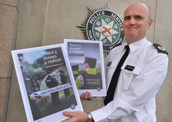 Assistant Chief Constable Mark Hamilton pictured with advertising posters for the PSNI's new recruitment drive.