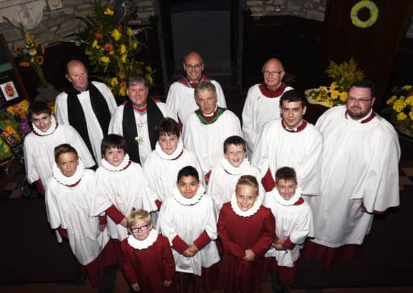 Members of the St Columb's Cathedral choir who took part in a Festal Choral Evensong for Thanksgiving for the Blessings of Harvest on Sunday evening. Included are Dr Martin Neary, guest organist, Dean William Morton and Canon David Crooks. INLS4015-151KM