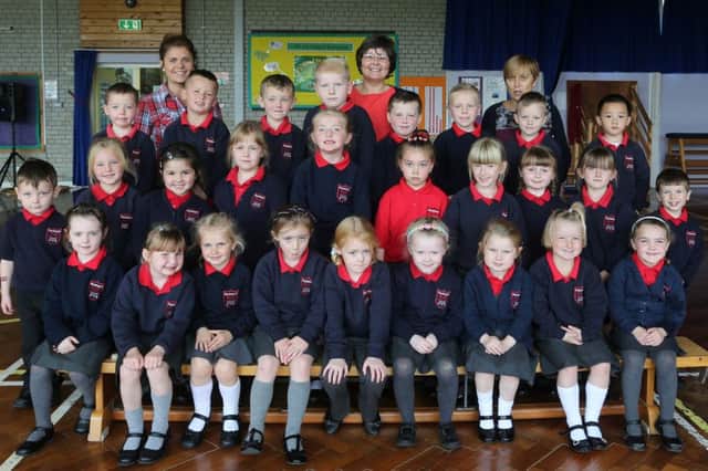 Parkhall Primary School P1 class with teacher Mrs Mrs Bannister (centre) plus classroom assistants Miss McIlwaine (left) and Mrs Rawlinston.