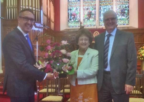 Elwyn Jones (right) and his wife Mavis, receive a gift from Rev. Daniel Kane to mark Elwyn's retirement after nearly ten years as Pastoral Assistant at West Presbyterian Church, Ballymena. (Submitted Picture).