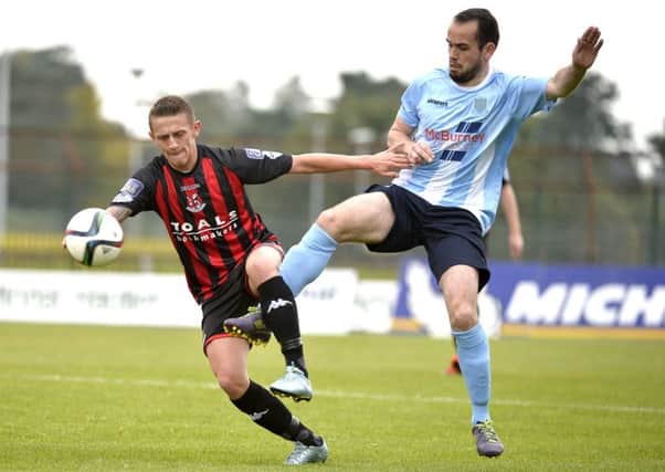 Ballymena United's Tony Kane competes with Crusaders' Matthew Snoddy during today's match at the Showgrounds. Picture: Press Eye.