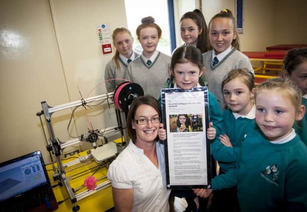 Katie, her mum Sharon with pupils from Thornhill College and Glendermott P.S.