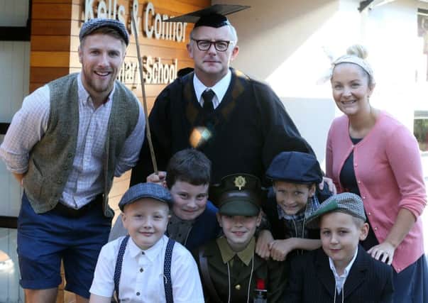 School principal Mr McClelland and teachers Mr McCluggage and Mrs Fisher with pupils Samuel, Lewis, Todd, Ewan and Ben the Kells & Connor Primary School 75th anniversary party. INBT 41-124JC