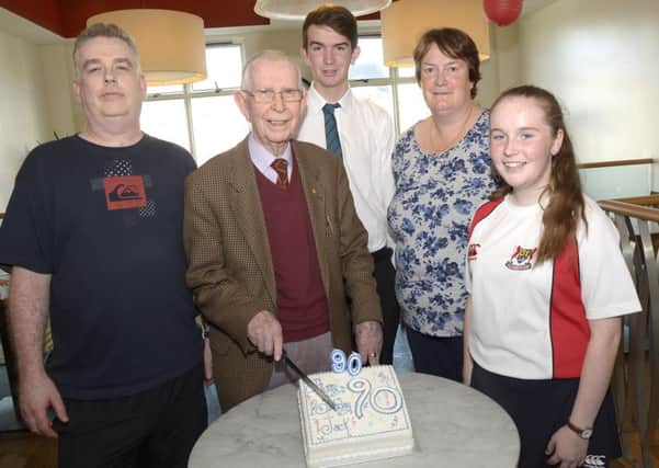 Banbridge trader Jack Crory celebrated his 90th birthday on Thursday last with a surprise party in Rosehip Cafe attended by family and fellow traders, Jack is pictured cutting his cake with son Andrew, daughter in law Valerie and grandchildren Mark and Amy ©Edward Byrne Photography INBL1540-221EB