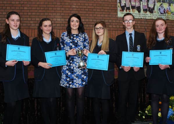 The five St Louis students who were joint recipients this year of the McCrea Cup, which is awarded for the top performance in Year 10.  From left to right: Caoimhinn Gormley, Bronwyn McAuley, Dr McAleese, Maria Buckland, Martyn Doherty and Neska Connon. (Submitted Picture).