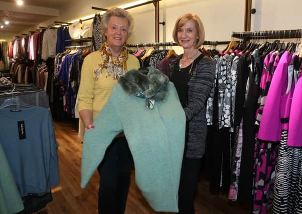 Libis McAllister (right) of Ultimate in Fashion, Wellington Street who will be holding a fashion show and open night in the shop to launch the Autumn Fashions 2015 on Thursday October 17th with the proceeds going to Northern Ireland Hospice. Libis is seen here at last week's launch with Samina Bonar of Hospice. INBT 42-102JC