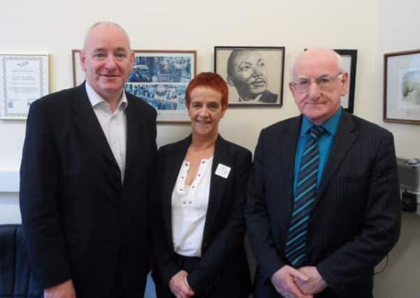 Foyle MP Mark Durkan meeting Strabane Community Project Manager Danny OHagan and Food Bank Manager Ursula Gallagher.