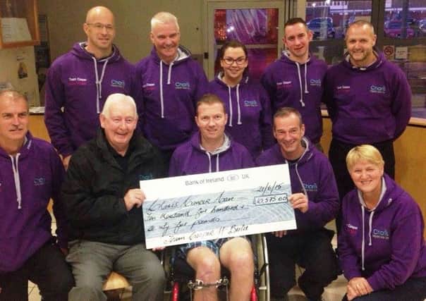 Francis Stewart and Paul McErlain present cheque to Charis