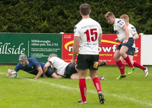 Chris O'Brien stretching to score for Lisburn. Pic by Gary Barlow