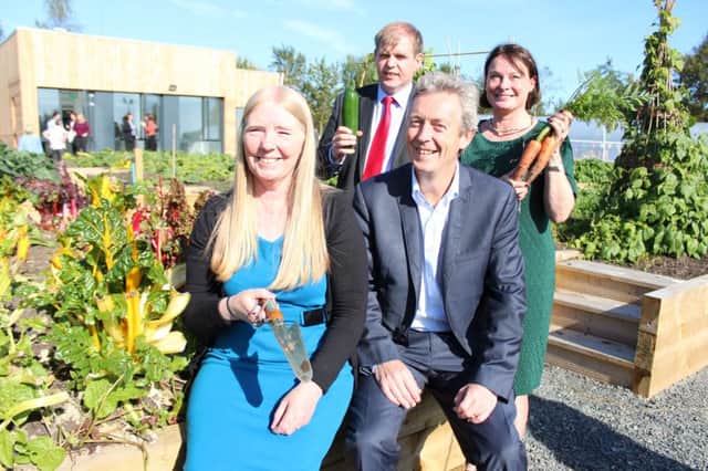 Annie Armstrong and Matthew McKinley, CNP;  Simon Murphy, Groundwork NI and Collette Fitzgerald, European Commission Office, at the opening of the Healthy Living Centre at Colin Allotments.