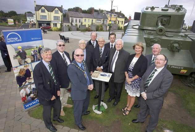 The Mayor of Mid and East Antrim Council, Councillor Billy Ashe, at the interpretative panel unveiling at Marine Gardens with,  from left, David McCorkell, Tom Crothers, Rey Kirk, Tom Carse, John Boyd; Sam Haldane; Wilson Kirker, Jacqueline Stewart, Henry Moore and Colin Davidson. INCT 40-705-CON