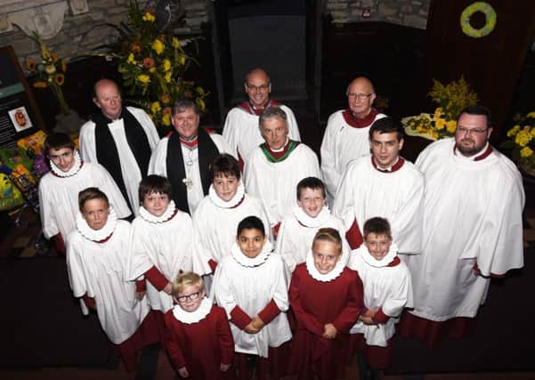 Members of the St. Columb's Cathedral choir who took part in a Festal Choral Evensong for Thanksgiving for the Blessings of Harvest on Sunday evening. Included are Dr Martin Neary, guest organist, Dean William Morton and Canon David Crooks. INLS4015-151KM