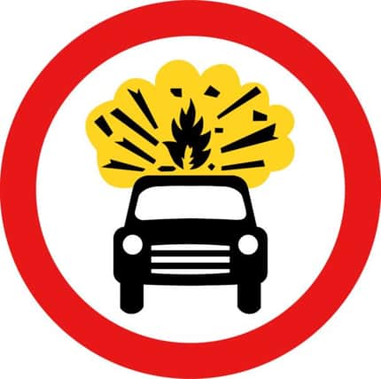 Roadsign with an exploding car by John Cliff. From OCAL 0.18 release.
