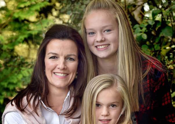 The Women Behind The Man...Wife of Northern Ireland manager Michael O'Neill, Bronagh and daughters Erin (12) and Olivia (8). INPT42-219. Photo by TONY HENDRON.