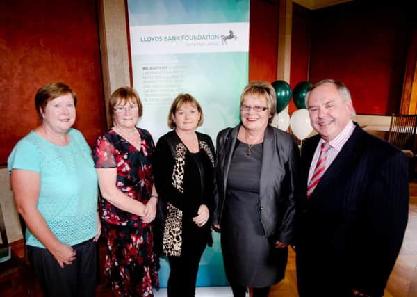 Lloyds Bank Foundation for NI Trustee, Janet Leckey from Newtownabbey (centre) with (l-r) Deirdre McAllister and Ita McNally (Community Circus Lisburn) and Joan and Harold Baird (Damask Community Outreach) at the Foundations special anniversary reception at Stormont. INNT 42-507CON