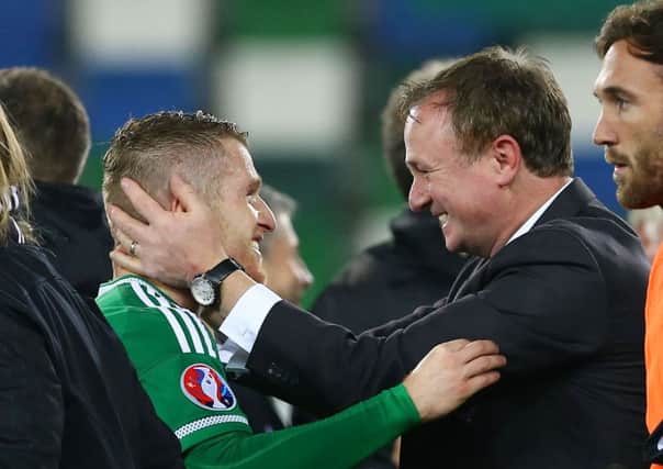 Northern Ireland manager Michael O'Neill celebrates with two-goal hero Steven Davis. Picture: Press Eye.