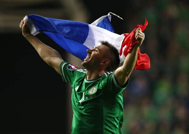 GOING TO FRANCE: Northern Ireland's  Gareth McAuley celebrates defeating  Greece