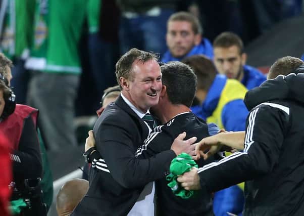 Northern Ireland manager Michael O'Neill celebrates after the final whistle
