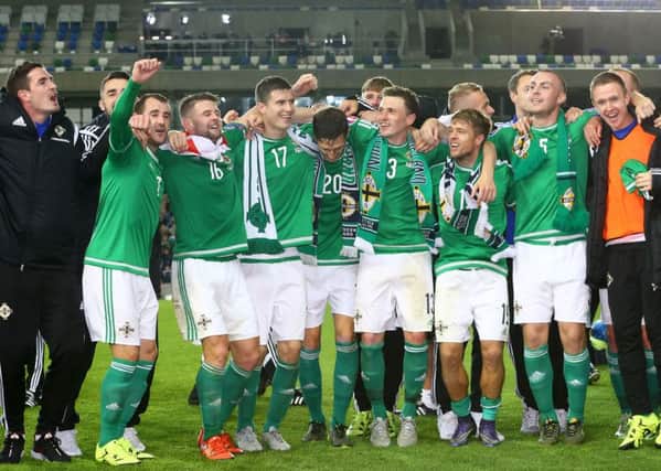 Northern Ireland players celebrate defeating Greece. The result sees the team qualify for the Euro Finals for the first time in their history. Picture by William Cherry