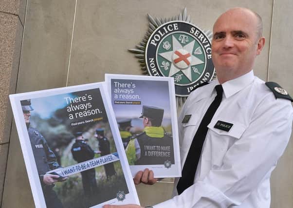 Assistant Chief Constable Mark Hamilton pictured at PSNI Headquarters Knock in Belfast with advertising posters for the police's new recruitment drive.