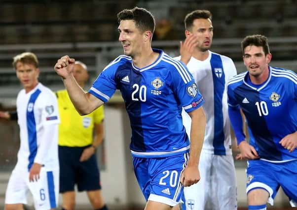 Craig Cathcart celebrates his goal against Finland, ensuring that NI drew, and ended their Euro 2016 campaign top of their group