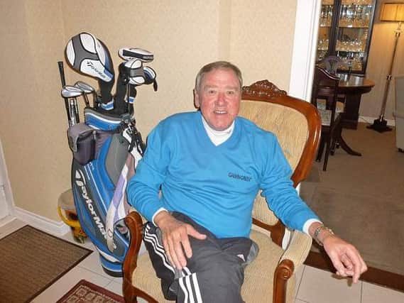 Kenny Stevenson and his clubs take a deserved rest after shooting a 65.