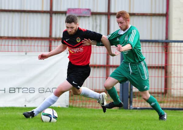 Tobermore Utd's Ryan Devine cuts out a Dundela attack during Saturday's league encounter at Fortwilliam Park.INMM4215-403