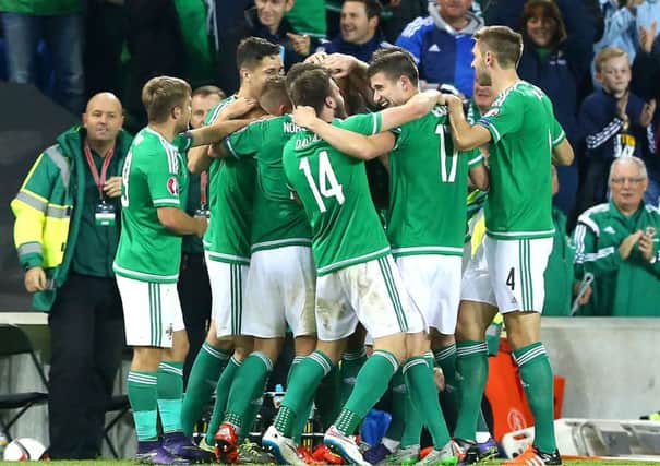 Gareth McAuley, Craig Cathcart, Paddy McNair and Corry Evans are among the Northern Ireland players celebrating after Josh Magennis put Northern Ireland two up against Greece. INLT 42-923-CON Photo: Presseye