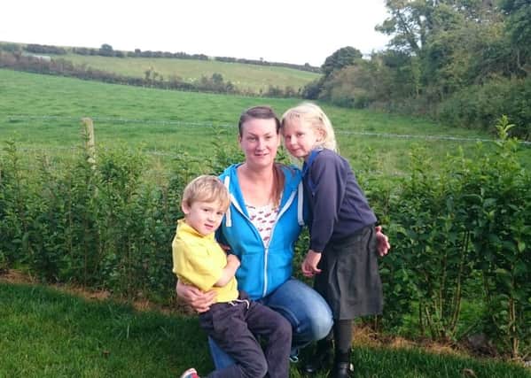Quarterland Road resident Kerry Smith pictured with her children Emma and Charlie Kernaghan in front of the proposed site for Gaelectric's green energy facility in Islandmagee.  INLT 42-685-SG