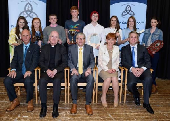 Pictured with past students at the St Benedicts College Annual Prizegiving are special guest Dr Mark Sweeney and as wife Colette along with Randalstown PP Fr. Boyle, school principal Mr Sean McAuley and vice-principal Mr Shivers. INBT 42-300JC