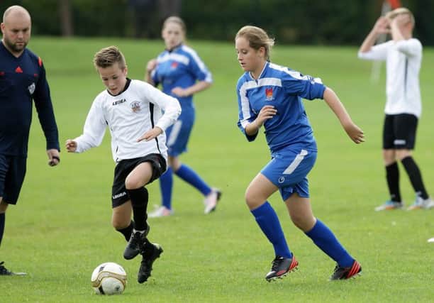 Youth soccer action from the under-13 game between Lisburn Ladies FC and Lisburn Distillery, at Wallace Park. US1541-508cd  Picture: Cliff Donaldson