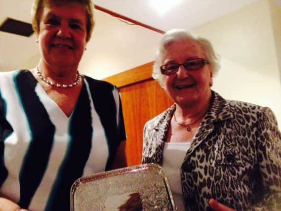 Joyce Hughes (left) with Eileen Marks receiving her prize.